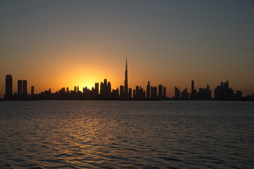 Obraz na płótnie Canvas Dubai slyline from Dubai Creek Harbour and Dubai canal to Downtown and Business Bay, United Arab Emirates