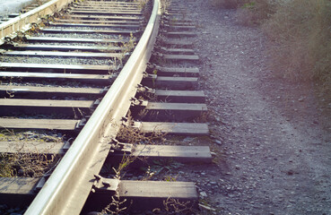 Railway tracks close-up. Rails and sleepers. Transport route. Romance of roads.