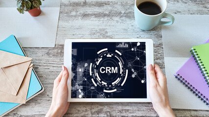 Naklejka premium CRM - customer relationship management system concept on screen.