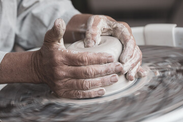 Closeup of Clay Bowl being Shaped into Bowl on Pottery Wheel