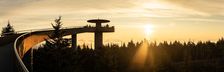 Sunrise with silhouette of concrete round lookout tower in smoky mountains