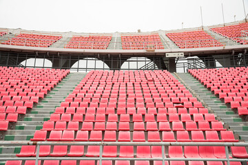 Fototapeta premium Pink spectator seats in a sports stadium.