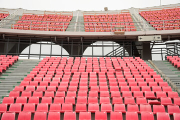 Fototapeta premium Pink spectator seats in a sports stadium.