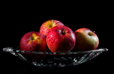 Red Apples in a glass bowl.