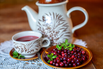 Cup of tea with vitamin C cranberries