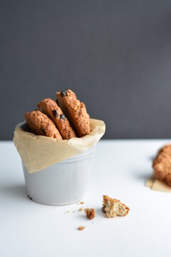 Gray jar with homemade oatmeat cookies on gray background. Copy space.