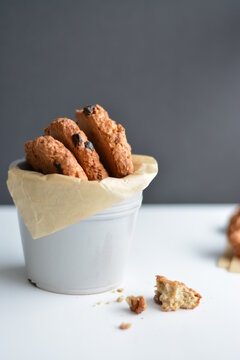 Gray jar with homemade oatmeat cookies on gray background. Copy space.