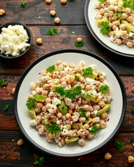 Chickpeas salad with feta cheese, avocado and herbs. healthy food