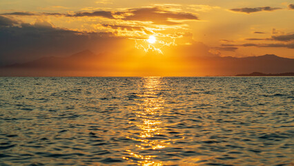 Kamchatka. Sunset in Avacha Bay with the reflections of the setting sun on the water