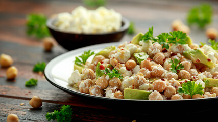 Chickpeas salad with feta cheese, avocado and herbs. healthy food