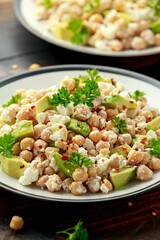 Chickpeas salad with feta cheese, avocado and herbs. healthy food