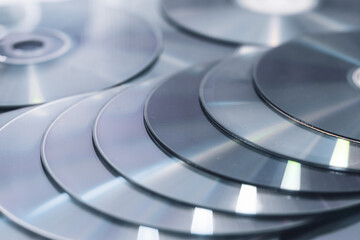 CD' DVD on white background. Pile of DVD compact disks