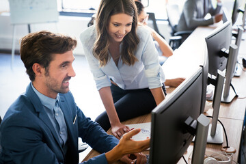Software engineers working on project and programming in company