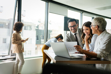 Portrait of business people, architects having discussion in office