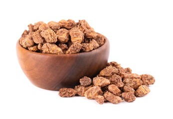 Tigernuts isolated on white background. Chufa nuts or tiger nuts in wooden bowl.