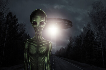 Green alien with black large glass eyes on the background of a flying saucer. UFO concept, aliens,...