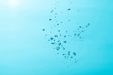 Close up of a water and air bubble on blue background.