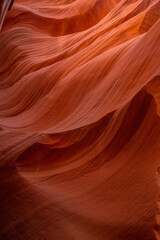 Vertical shot of red rock formation in Antelope Canyon, unusual bewitching pattern