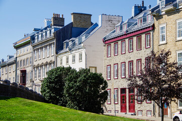 Romantic backstreet, side street or alley in historic old town of Quebec City, Canada with French...