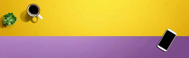 Fototapeta premium Smartphone with a coffee mug and succulent plant - flat lay