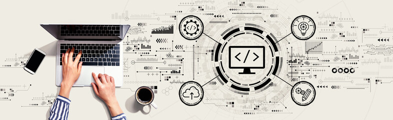 Obraz na płótnie Canvas Web development concept with person using a laptop computer