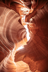 Famous Antelope canyon in daylight, mesmerizing rock curves. Vertical shot