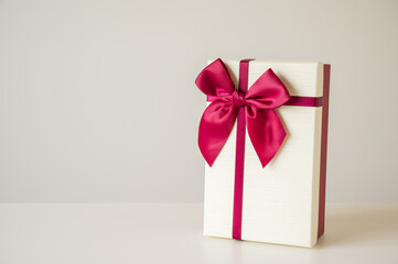 Gift box mockup on the white table with copy space. Merry christmas and happy new years background for text advertise.
