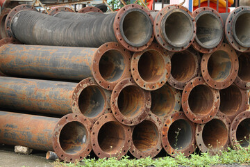 Pile of rusty drainage pipe