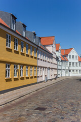 Cobblestoned street with historic houses in Ribe, Denmark