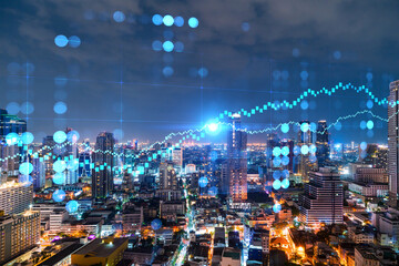 Naklejka na ściany i meble FOREX graph hologram, aerial night panoramic cityscape of Bangkok, the developed location for stock market researchers in Asia. The concept of fundamental analysis. Double exposure.