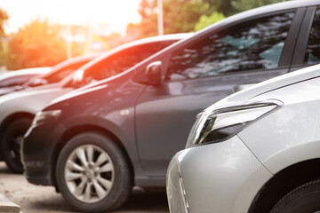 Close-up of front car parking in line with sunlight.