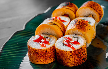 sushi roll with fish and rice in plate