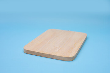 Soft focus of wooden base on blue background.