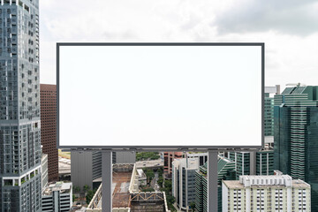Obraz premium Blank white road billboard with Singapore cityscape background at day time. Street advertising poster, mock up, 3D rendering. Front view. The concept of marketing communication to promote.