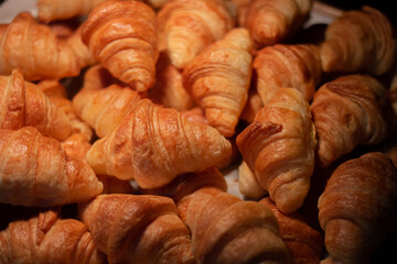 Group of Fresh Croissant in the bakery shop.