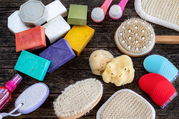 Fototapeta na wymiar Many kinds of bath sponges on the wooden table