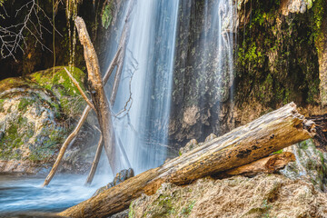 small waterfall of a river photographed with long exposure silk effect