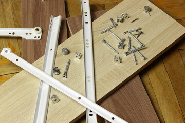 Roller guides for installation during furniture assembly, background.