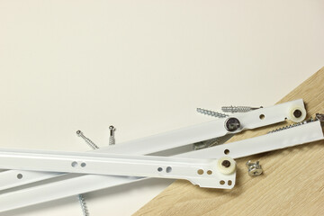 Roller guides for installation during furniture assembly, background.