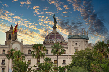 photo of the typical central post and telegraph office in the Gothic Quarter of Barcelona at sunset.