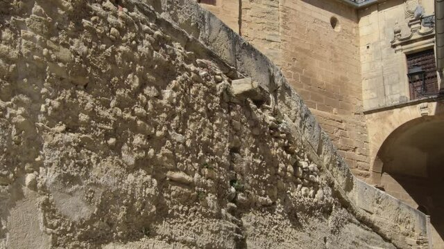 onumental street with medieval wall and street arc. Tilt