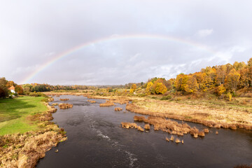 Rainbow across the river after the rain