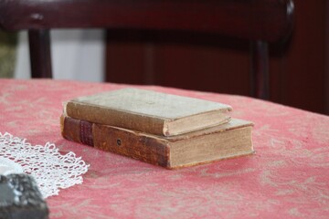 two old books on a wooden table