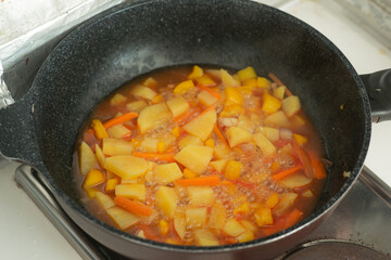 Homemade potato cooking in a pan