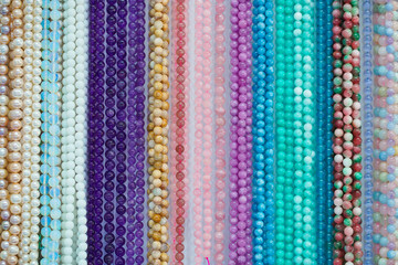 Gem stones. Top view of  colorful precious gem stones collection for lady accessories such as necklaces and bracelets.