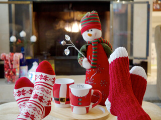 Cozy red socks, safe at home by the fireplace