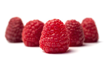 Fresh ripe raspberries on a white background - a group of five berries. Homemade berry isolated.