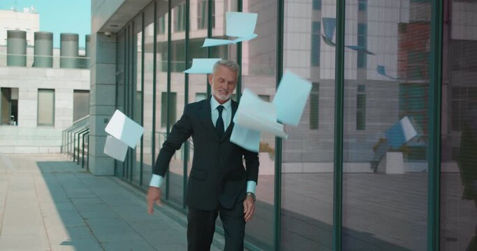 Happy entrepreneur throwing documents up, celebrating victory, successful deal