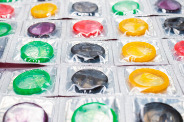 Colorful condoms background.
