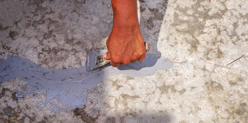 Repair of cracks in cement floor.